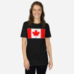 Front of Canada Flag black unisex basic softstyle t-shirt on female model with large Canadian flag printed across chest.