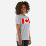 Front of Canada Flag sport grey unisex basic softstyle t-shirt on female model with large Canadian flag printed across chest.