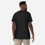 All black back of Canada Flag unisex garment-dyed heavyweight t-shirt on male model.