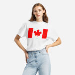 Front of Canada Flag white unisex garment-dyed heavyweight t-shirt on female model with large Canadian flag printed across chest.