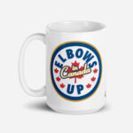 Elbows Up In Canada Canadian Flag white ceramic 15oz mug held by male model showing 'Elbows Up In Canada' circle design.