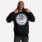 Front of Elbows Up In Canada black unisex premium hoodie on male model with large 'Elbows Up In Canada' circle design.