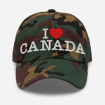 Front of I Love Canada green camo classic dad hat showing words 'I Love Canada' embroidered white with red heart for the word 'love'.