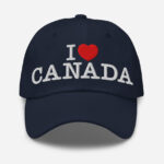 Front of I Love Canada navy classic dad hat showing words 'I Love Canada' embroidered white with a red heart in place of the word 'love'.