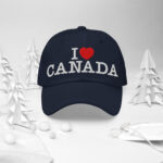 Front of I Love Canada navy classic dad hat in white forest scene showing words 'I Love Canada' embroidered white with red heart for the word 'love'.