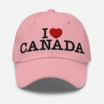 Front of I Love Canada pink classic dad hat showing words 'I Love Canada' embroidered white with a red heart in place of the word 'love'.