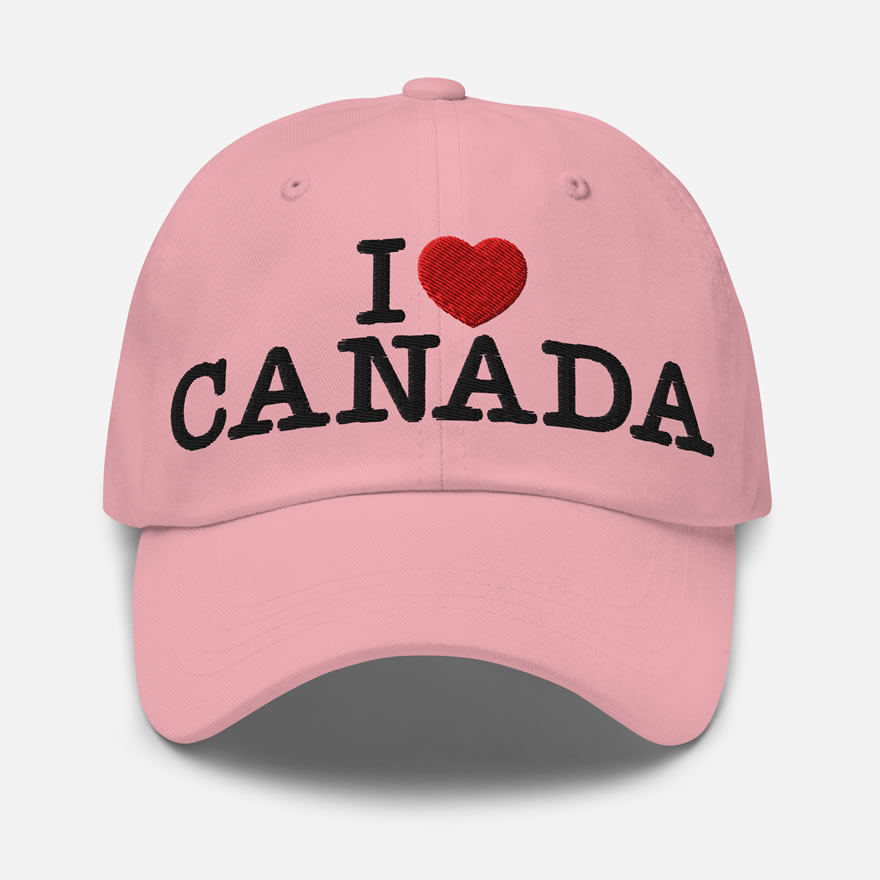 Front of I Love Canada pink classic dad hat showing words 'I Love Canada' embroidered white with a red heart in place of the word 'love'.