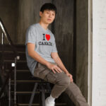 Front of I Love Canada sport grey unisex basic softstyle t-shirt on male model with 'I Love (heart) Canada' design across chest.