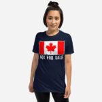 Front of Canada Is Not. For. Sale. navy unisex basic softstyle t-shirt on female showing Canada Flag with words 'Not. For. Sale.' below in white.