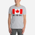 Front of Canada Is Not. For. Sale. sport grey unisex basic softstyle t-shirt on male showing Canada Flag with words 'Not. For. Sale.' below in black.