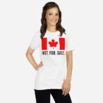 Front of Canada Is Not. For. Sale. white unisex basic softstyle t-shirt on female showing Canada Flag with words 'Not. For. Sale.' below in black.