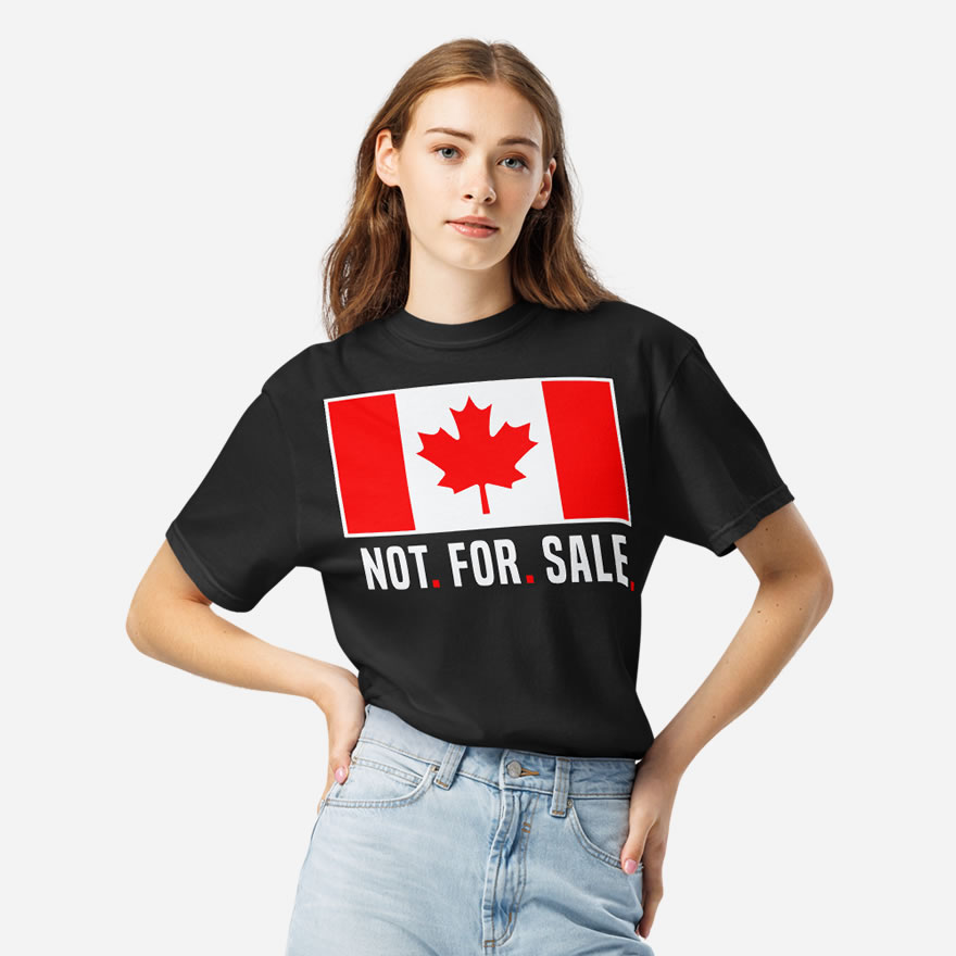 Front of Canada Is Not. For. Sale. black unisex basic softstyle t-shirt on female showing Canada Flag with words 'Not. For. Sale.' below in white.