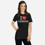 Front of I Love Canada black unisex basic softstyle t-shirt on female model with 'I Love (heart) Canada' design across chest.