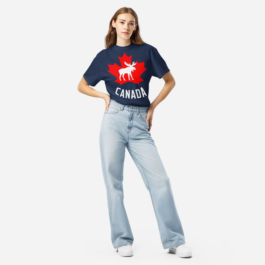 Front of Canada Moose navy unisex heavyweight t-shirt on girl showing maple leaf & moose print. Canada written below.