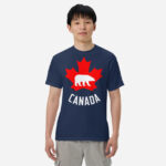 Front of Canada Polar Bear navy unisex heavyweight t-shirt on guy with maple leaf & Polar Bear print. Canada written below.