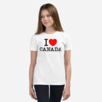 Front of I Love Canada white unisex youth staple t-shirt on girl model showing 'I Love (heart) Canada' design.