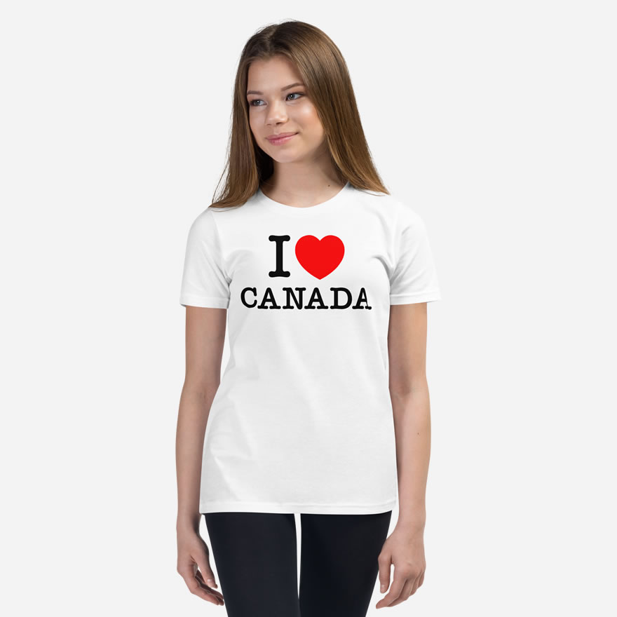Front of I Love Canada white unisex youth staple t-shirt on girl model showing 'I Love (heart) Canada' design.