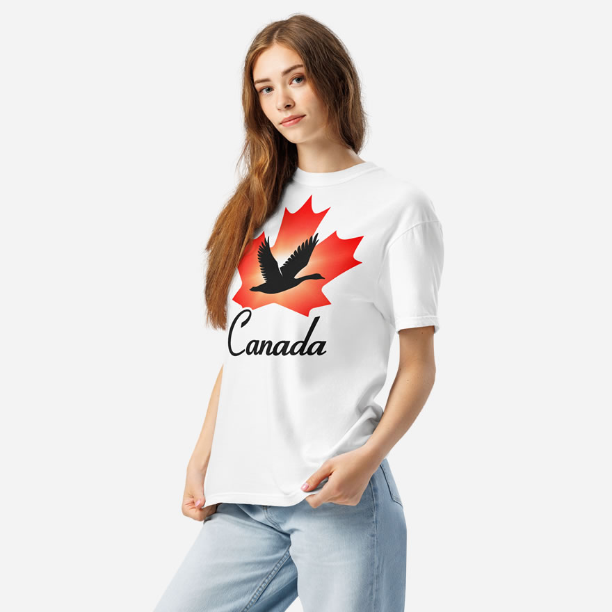 Front of Canada Goose white unisex heavyweight t-shirt on girl showing maple leaf & goose print. Canada written below.
