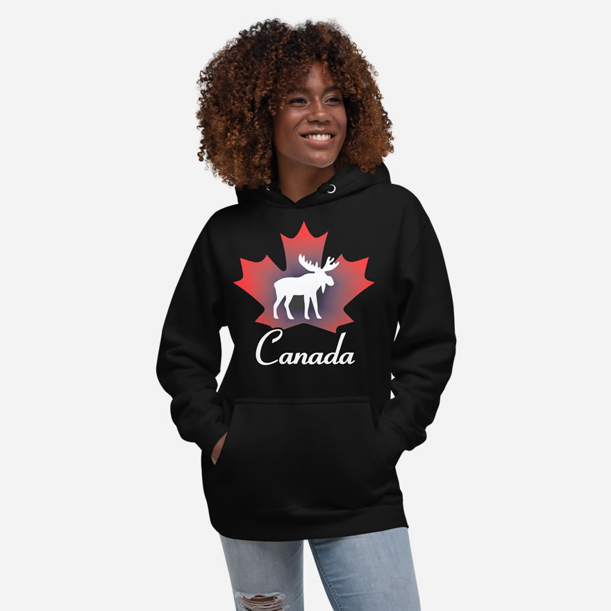 Front of Canada Moose black unisex premium hoodie on female showing maple leaf & moose print with Canada written below.
