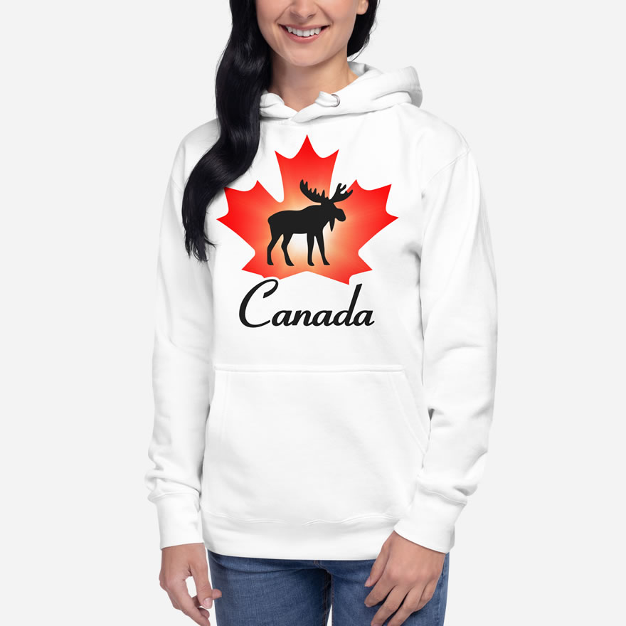 Front of Canada Moose white unisex premium hoodie on female showing maple leaf & moose print. Canada written below.