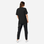 All black back of Canada Moose unisex garment-dyed heavyweight t-shirt on female model.