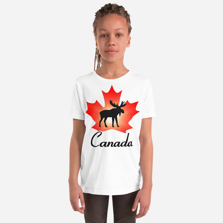 Front of Canada Moose white unisex youth staple t-shirt on girl showing maple leaf & moose print. Canada written below.