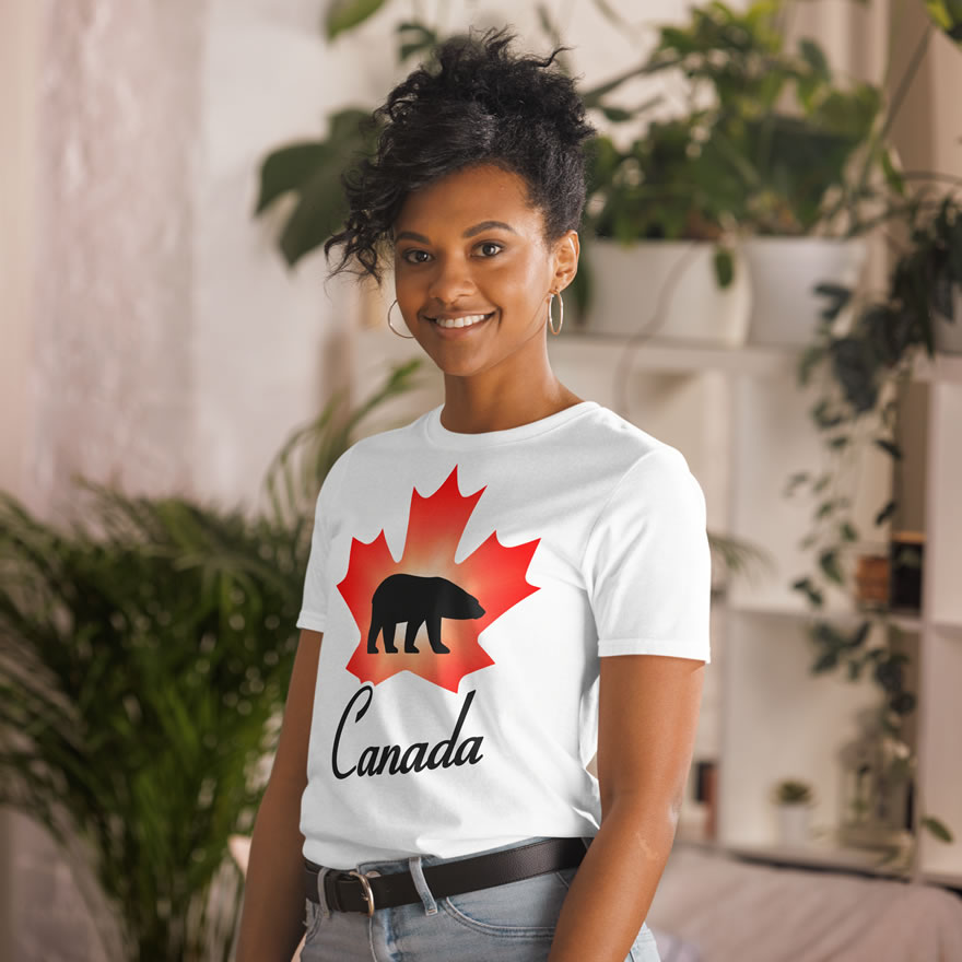 Front of Canada Polar Bear white unisex t-shirt on female model with maple leaf & Polar Bear print. Canada written below.