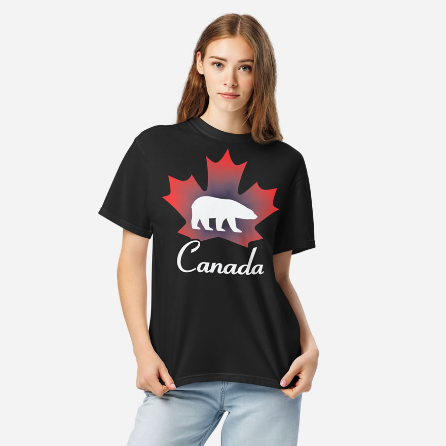 Front of Canada Polar Bear black unisex heavyweight t-shirt on girl with maple leaf & Polar Bear print. Canada written below.