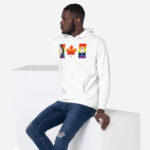 Front of Canada Two-Spirit Intersex-Inclusive Progress Pride Flag hoodie white premium pullover on model. Canada flag has pride stripes for bars & maple leaf.