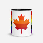 Canada Two-Spirit Intersex-Inclusive Progress Pride Flag mug 11oz black inside. Maple leaf is layered with 6 shades of red and orange pride stripes.