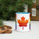 Canada Two-Spirit Intersex-Inclusive Progress Pride Flag mug 11oz blue inside. Maple leaf is layered with 6 shades of red and orange pride stripes.