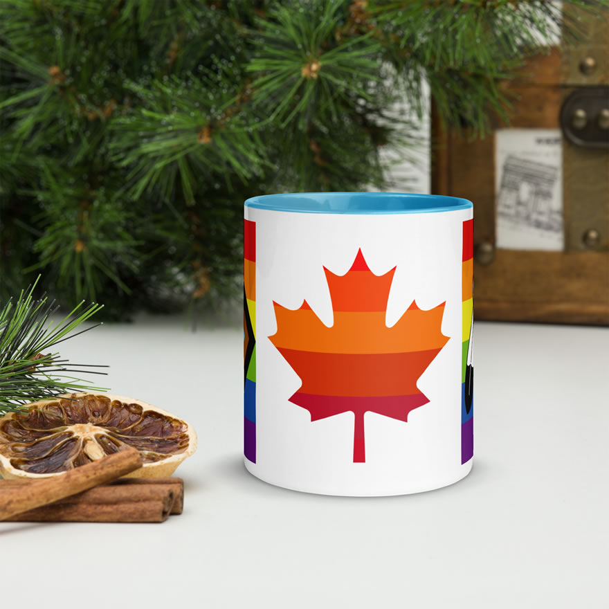 Canada Two-Spirit Intersex-Inclusive Progress Pride Flag mug 11oz blue inside. Maple leaf is layered with 6 shades of red and orange pride stripes.