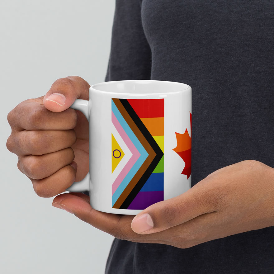 Canada Two-Spirit Intersex-Inclusive Progress Pride Flag white 11oz mug. Handle on left held by model. Flag has Intersex-Inclusive Progress Pride colours for left bar.