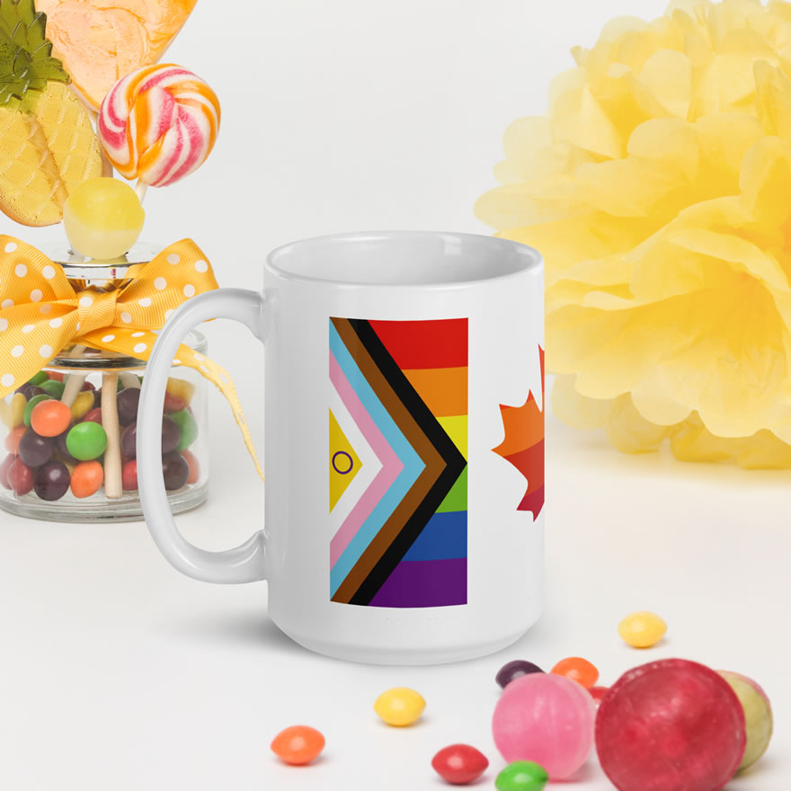Canada Two-Spirit Intersex-Inclusive Progress Pride Flag white glossy 15oz mug. Handle on left next to candy. Flag has Intersex-Inclusive Progress Pride colours for left bar.