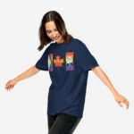 Front of Canada 2-Spirit Intersex-Inclusive Progress Pride Flag t-shirt true navy unisex heavyweight tee on model. Flag has pride stripes for bars & maple leaf.