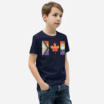Front of Canada Two-Spirit Intersex-Inclusive Progress Pride Flag youth t-shirt navy staple tee on boy. Flag has pride stripes for the bars and maple leaf.