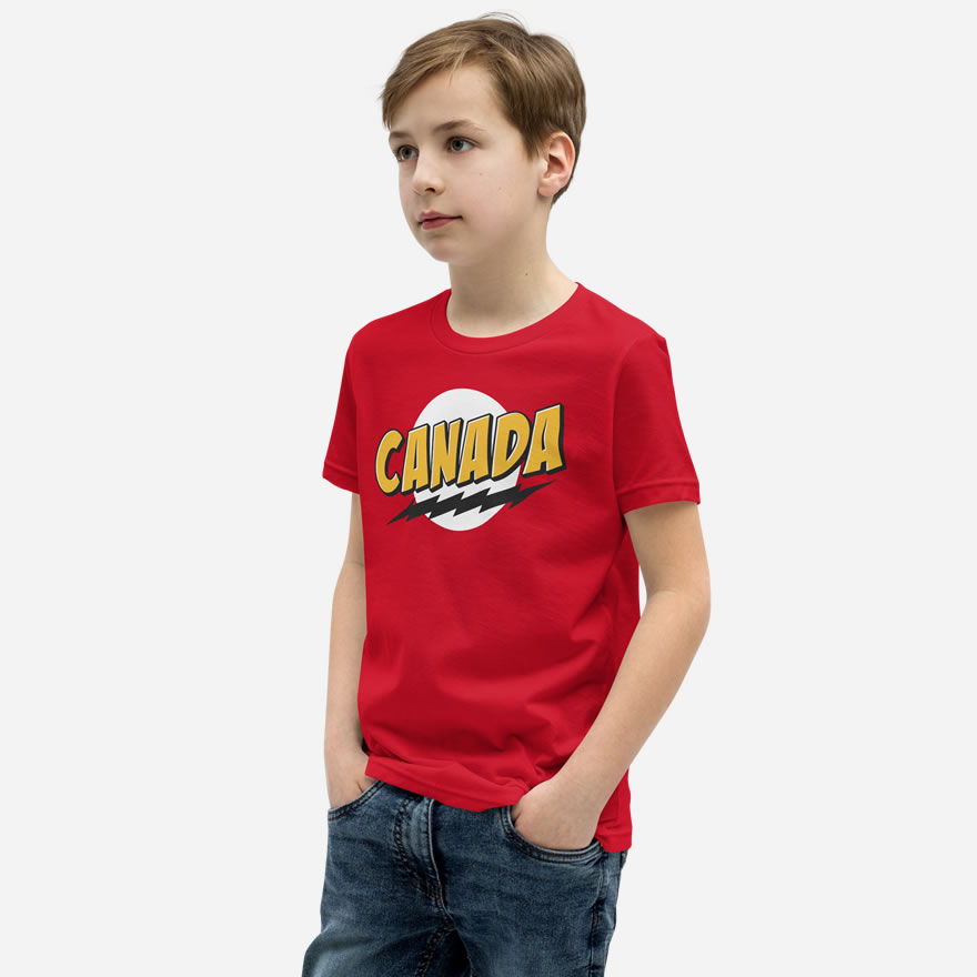 Front of Super Canada t-shirt red youth staple tee on boy. Canada in thick yellow font, black lightning bolt on white circle.