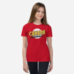 Front of Super Canada t-shirt red youth staple tee on girl. Canada in thick yellow font, black lightning bolt on white circle.