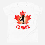 Front of Team Canada Girl's Soccer white youth staple tee. Player kicking ball silhouette on red maple leaf. Says Team Canada.