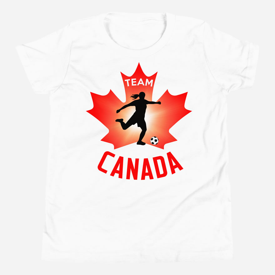 Front of Team Canada Girl's Soccer white youth staple tee. Player kicking ball silhouette on red maple leaf. Says Team Canada.