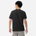 Solid black back of Team Canada Men's Soccer t-shirt unisex garment-dyed heavyweight Canadian football tee on man.