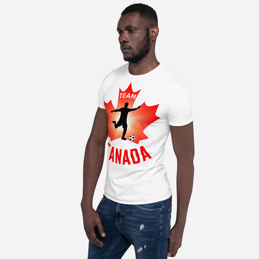 Front of Men's Soccer white unisex t-shirt on man. Player kicking ball figure on maple leaf. Tee says Team Canada.