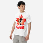 Front of Women's Soccer white heavyweight t-shirt on man. Player kicking ball silhouette on red maple leaf. Says Team Canada.