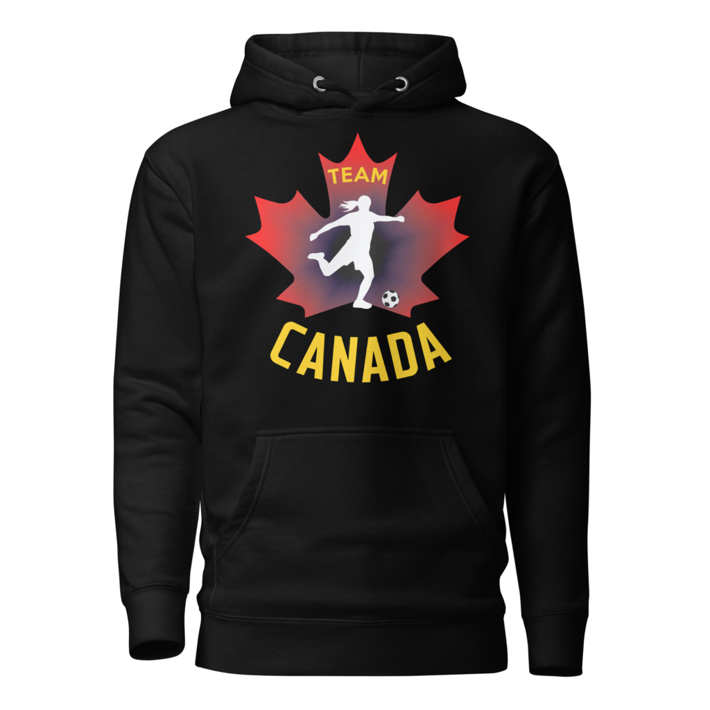 Front of Women's Soccer hoodie black unisex premium pullover. Player kicking ball silhouette on maple leaf. Says Team Canada.