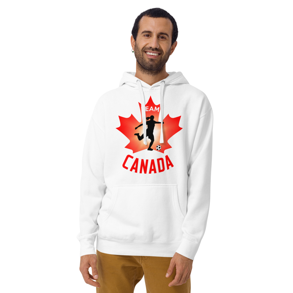 Front of Women's Soccer white premium hoodie on man. Player kicking ball silhouette on maple leaf. Says Team Canada.