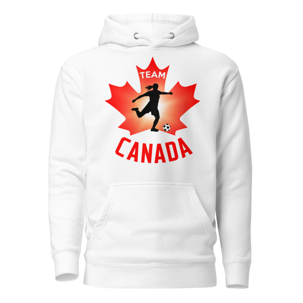 Front of Women's Soccer hoodie white unisex premium pullover. Player kicking ball silhouette on maple leaf. Says Team Canada.