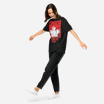 Front of Canada Red & White Maple Leaf t-shirt black unisex heavyweight tee on model. Flag has pride stripes for bars and maple leaf.