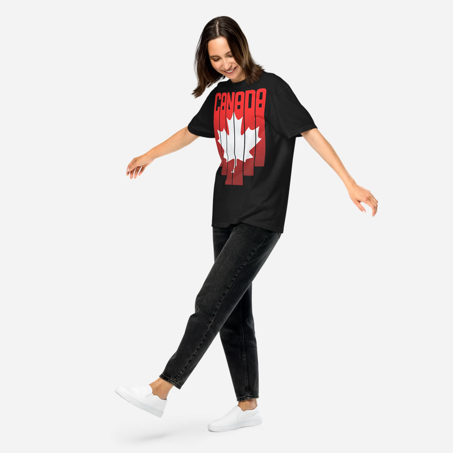 Front of Canada Red & White Maple Leaf t-shirt black unisex heavyweight tee on model. Flag has pride stripes for bars and maple leaf.