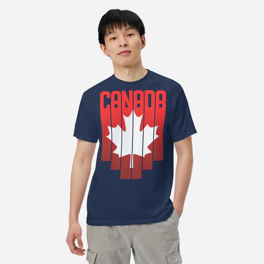 Front of Canada Red & White Maple Leaf t-shirt true navy unisex heavyweight tee on model. Flag has pride stripes for bars & maple leaf.