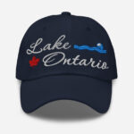 Front of Lake Ontario navy classic dad hat showing 'Lake Ontario' embroidered white along with red maple leaf & blue wave.